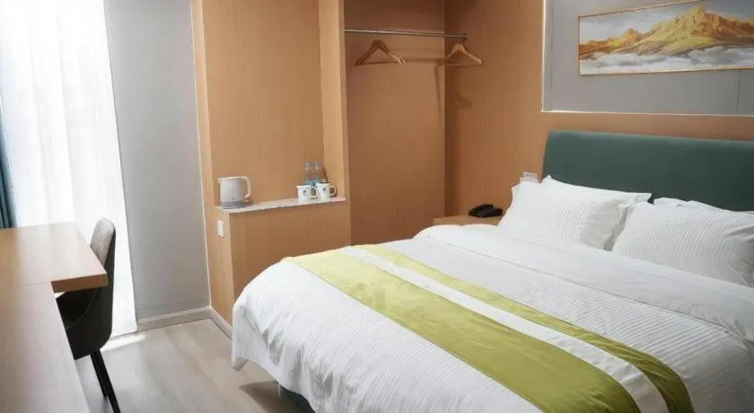 Bed in GreenTree Inn Taicang Baolong Square Hotel