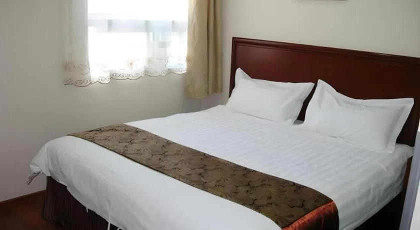 Bed in GreenTree Inn Taicang Baolong Square Hotel