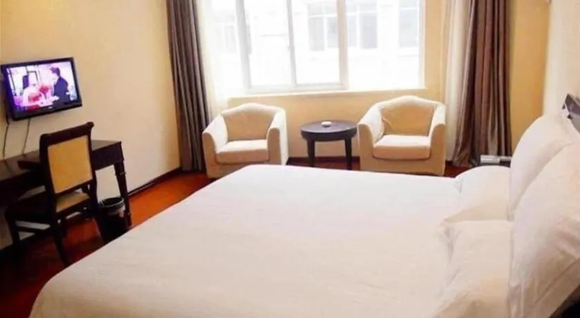 Bed in GreenTree Inn Taicang Baolong Square Hotel