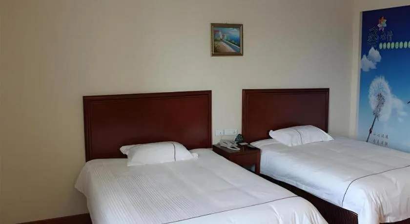 Bed in GreenTree Inn Taicang Baolong Square Hotel