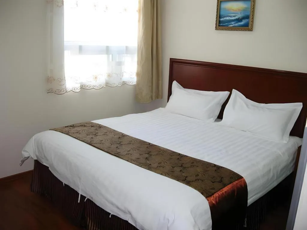 Bed in GreenTree Inn Taicang Baolong Square Hotel