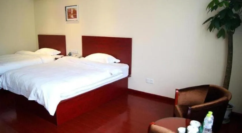 Bed in GreenTree Inn Taicang Baolong Square Hotel