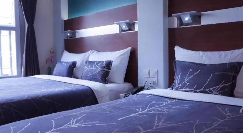 Bed in The Keong Saik Hotel