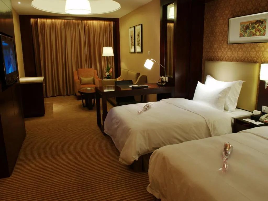 Bed in Yiwu Shinsun International Hotel