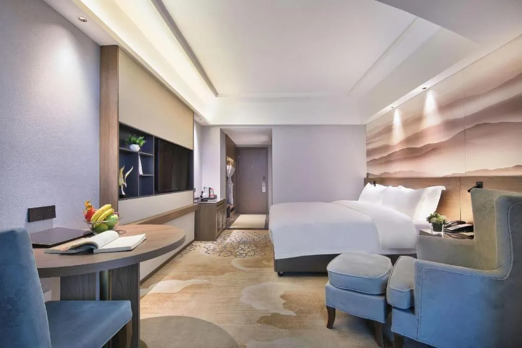 Bed in Vienna Hotel Guangxi Guilin 7-Star Wanda Plaza