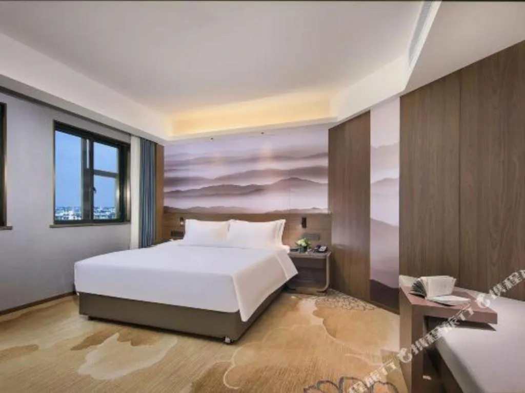 Bed in Vienna Hotel Guangxi Guilin 7-Star Wanda Plaza