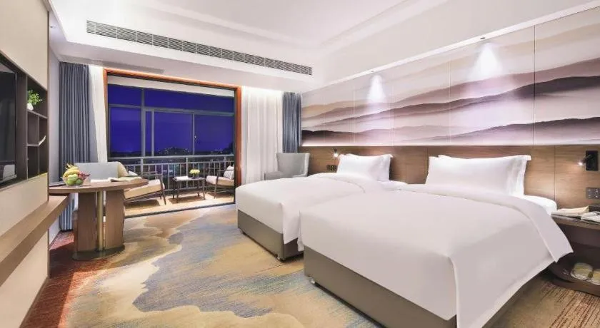 Bed in Vienna Hotel Guangxi Guilin 7-Star Wanda Plaza
