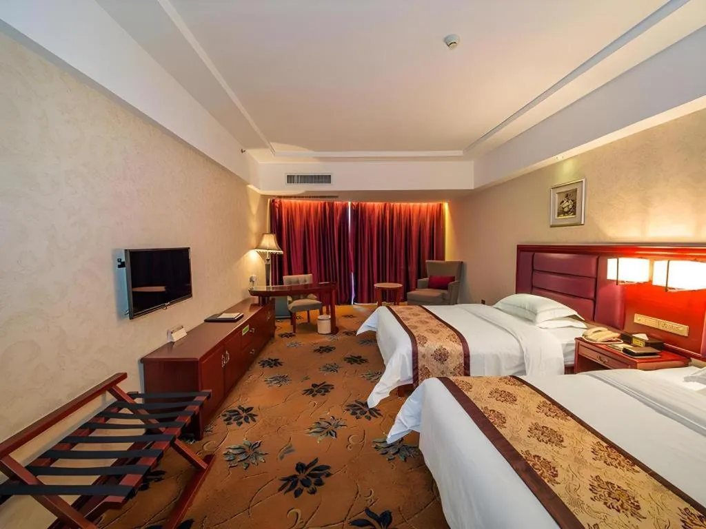 Bed in Vienna Hotel Guangxi Guilin 7-Star Wanda Plaza
