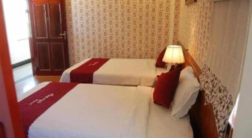 Bed in Omega Da Nang Beach Hotel