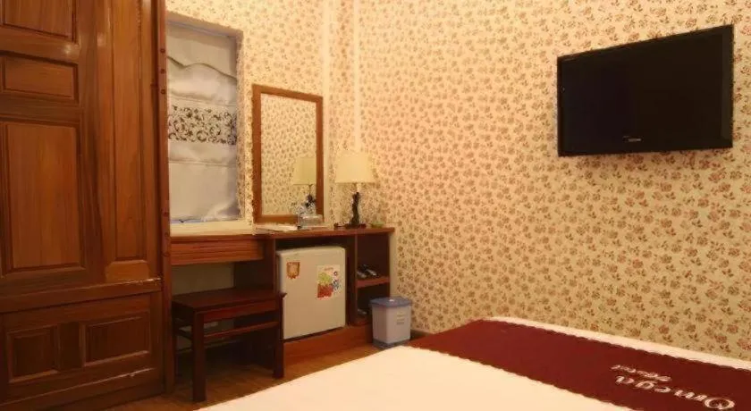 Bed in Omega Da Nang Beach Hotel