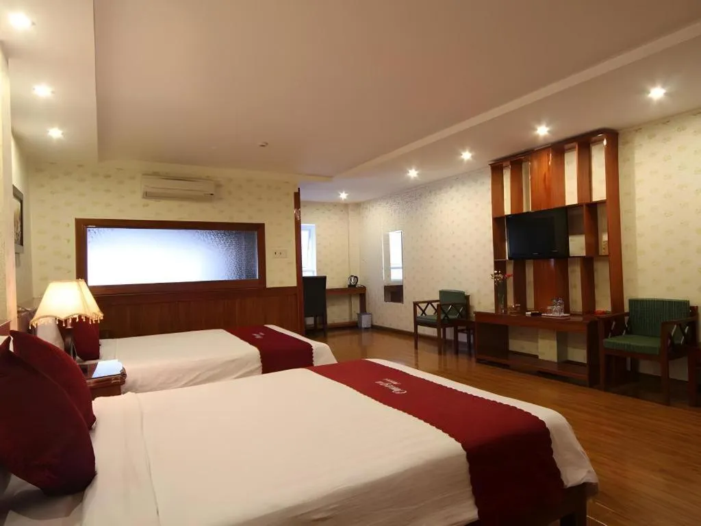 Bed in Omega Da Nang Beach Hotel