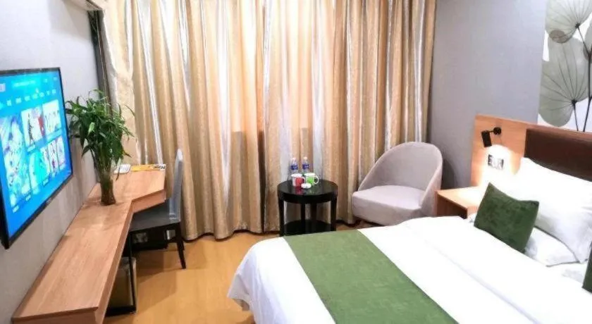 Bed in GreenTree Inn Yixing Zhangzhu Express Hotel