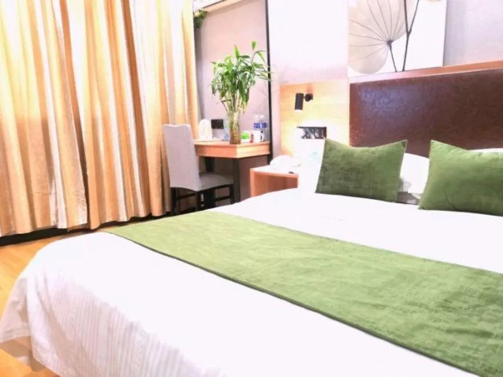 Bed in GreenTree Inn Yixing Zhangzhu Express Hotel