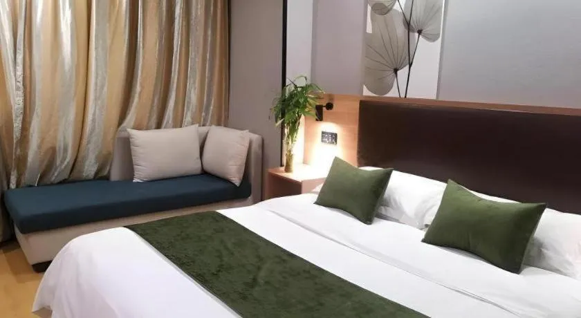 Bed in GreenTree Inn Yixing Zhangzhu Express Hotel