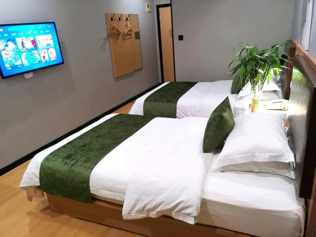 Bed in GreenTree Inn Yixing Zhangzhu Express Hotel