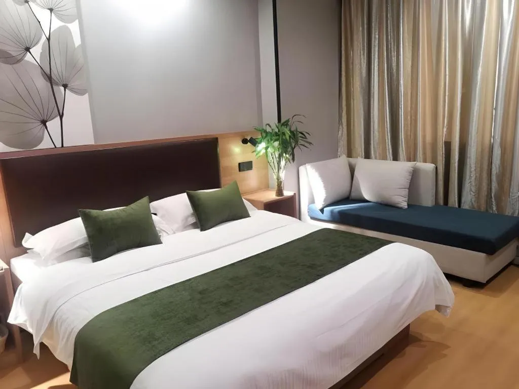 Bed in GreenTree Inn Yixing Zhangzhu Express Hotel