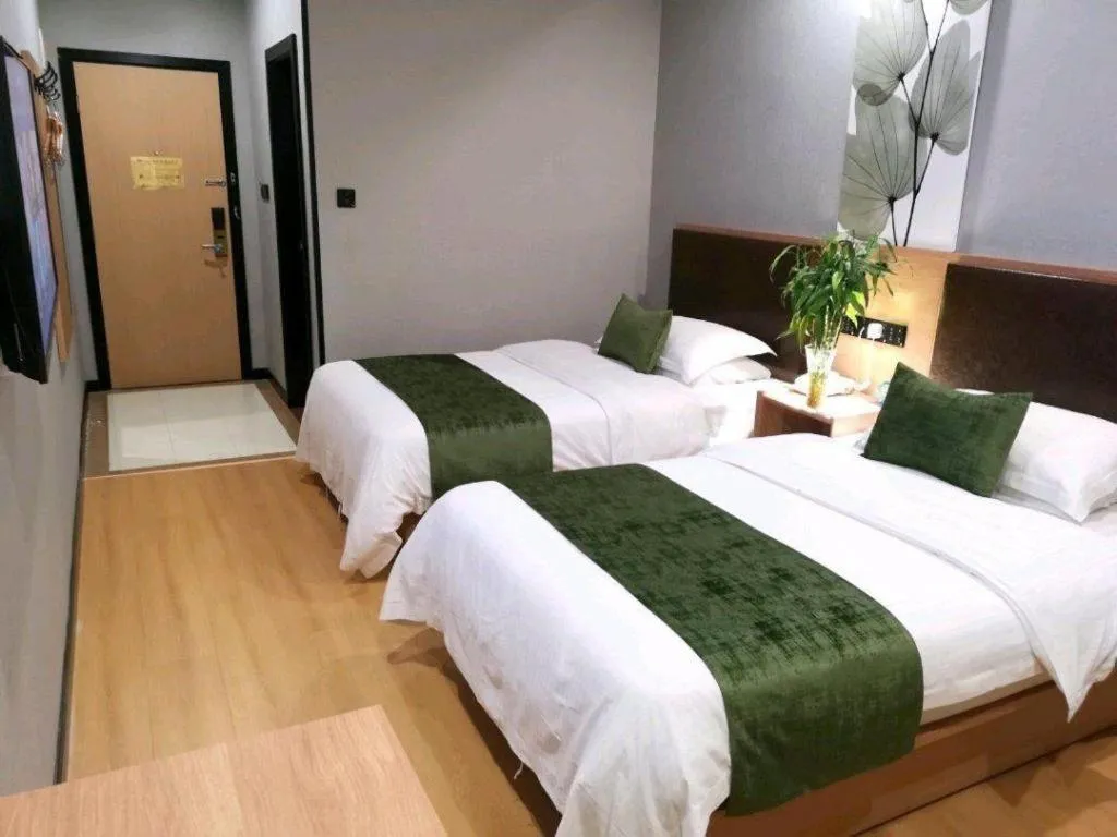 Bed in GreenTree Inn Yixing Zhangzhu Express Hotel
