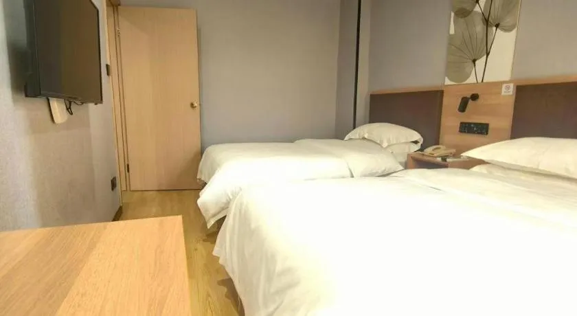 Bed in GreenTree Inn Yixing Zhangzhu Express Hotel