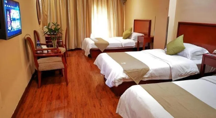 Bed in GreenTree Inn Yixing Zhangzhu Express Hotel