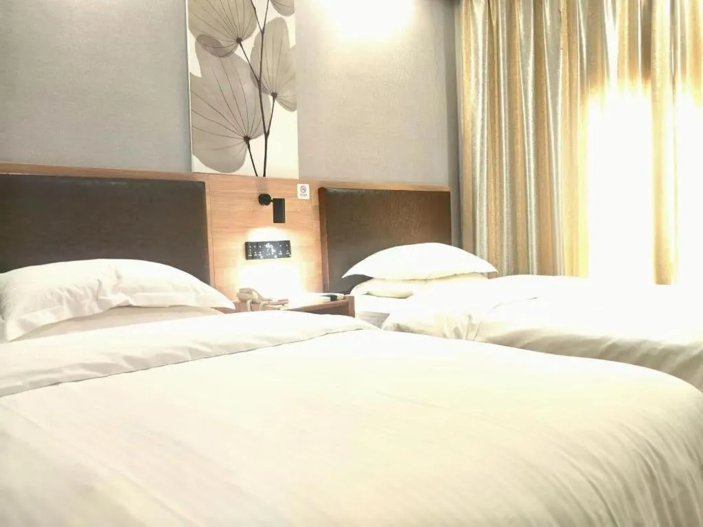 Bed in GreenTree Inn Yixing Zhangzhu Express Hotel