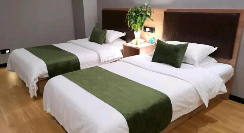Bed in GreenTree Inn Yixing Zhangzhu Express Hotel