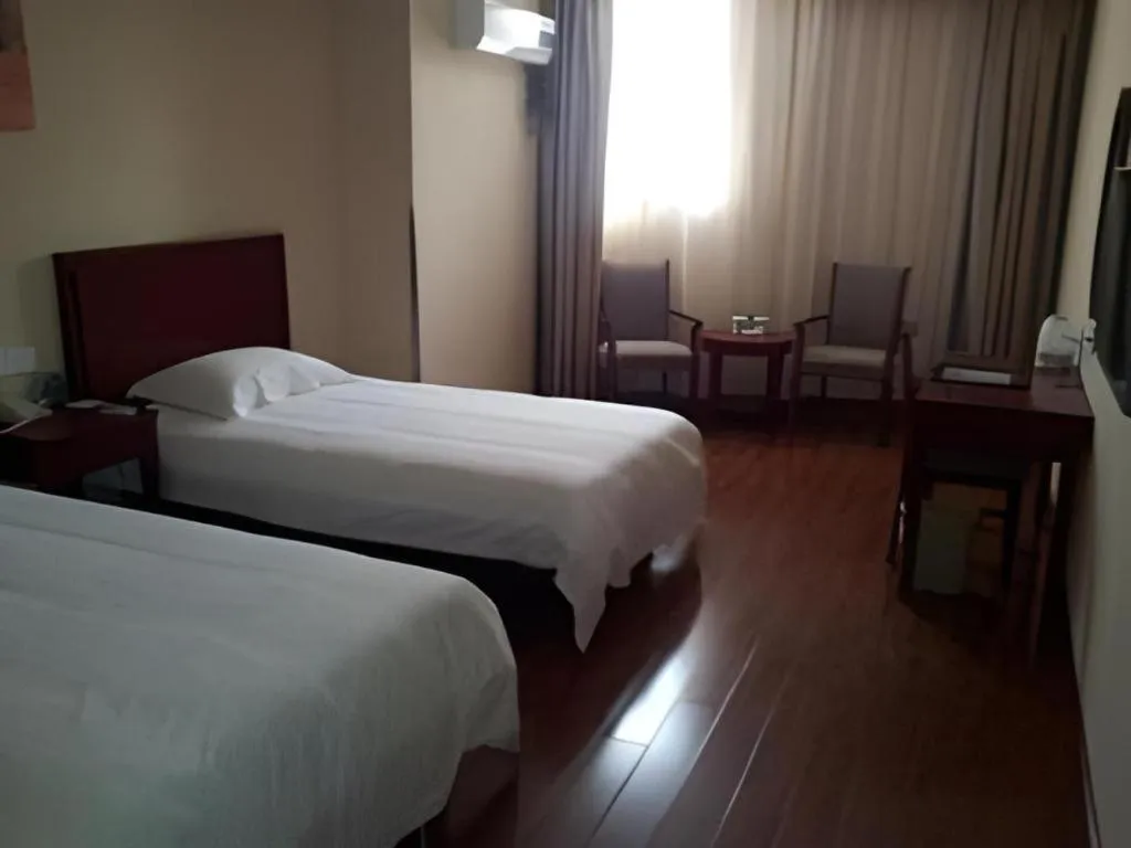 Bed in GreenTree Inn Yixing Zhangzhu Express Hotel
