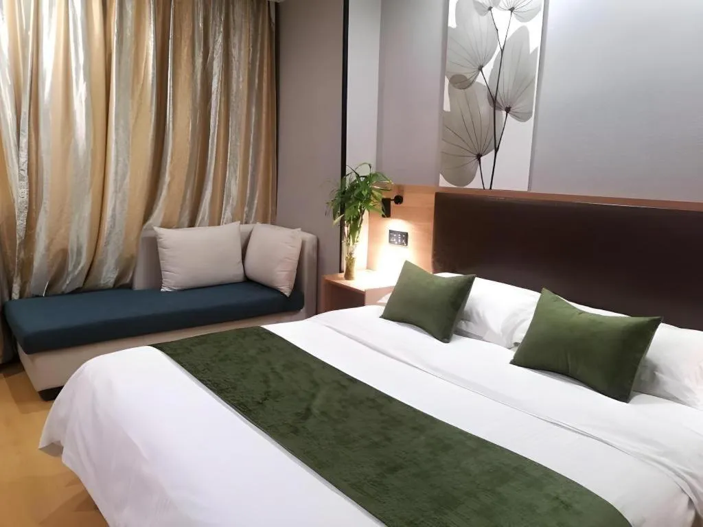 Bed in GreenTree Inn Yixing Zhangzhu Express Hotel