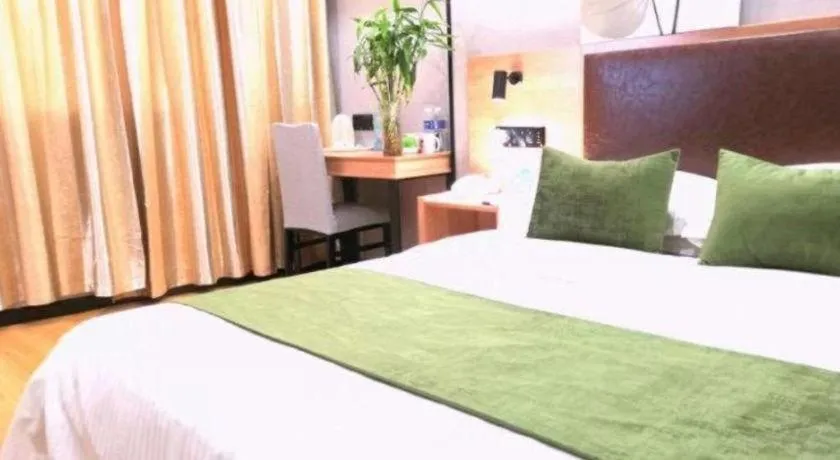 Bed in GreenTree Inn Yixing Zhangzhu Express Hotel