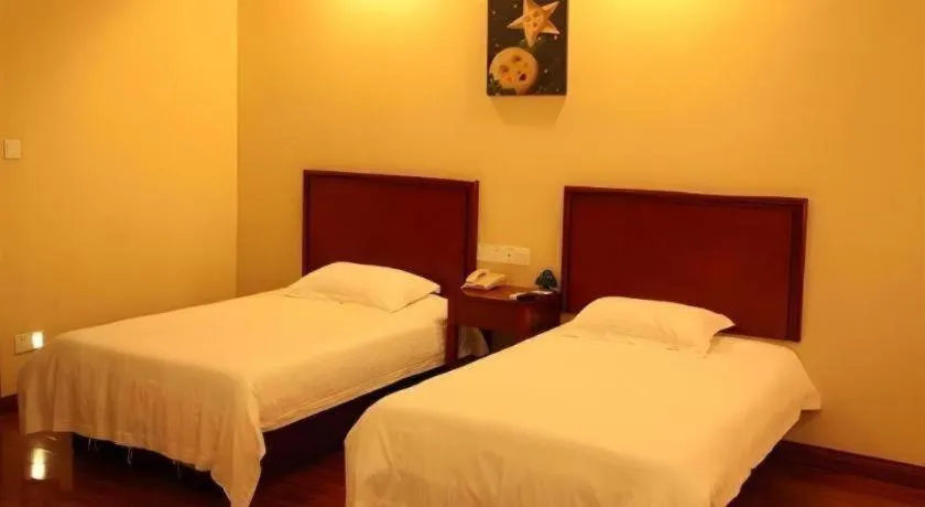 Bed in GreenTree Inn Yixing Zhangzhu Express Hotel