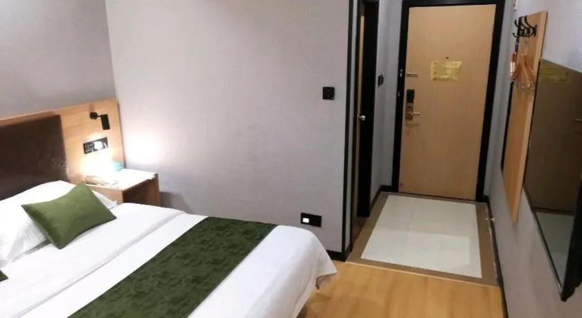 Bed in GreenTree Inn Yixing Zhangzhu Express Hotel