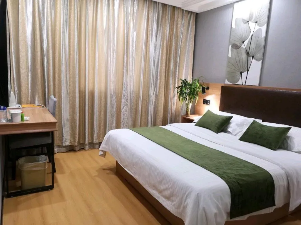 Bed in GreenTree Inn Yixing Zhangzhu Express Hotel