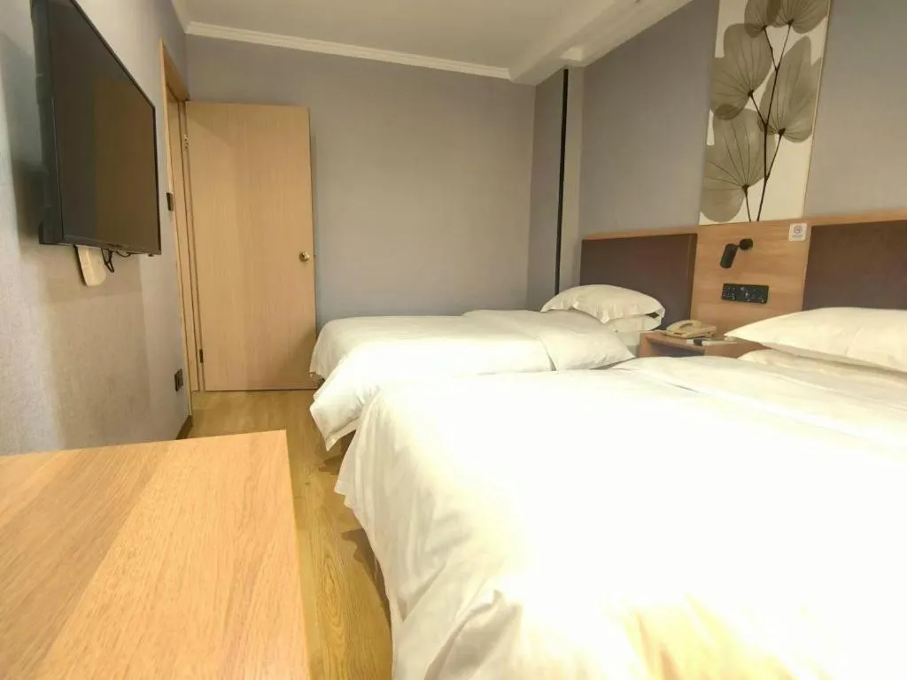 Bed in GreenTree Inn Yixing Zhangzhu Express Hotel