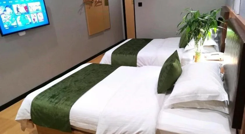 Bed in GreenTree Inn Yixing Zhangzhu Express Hotel