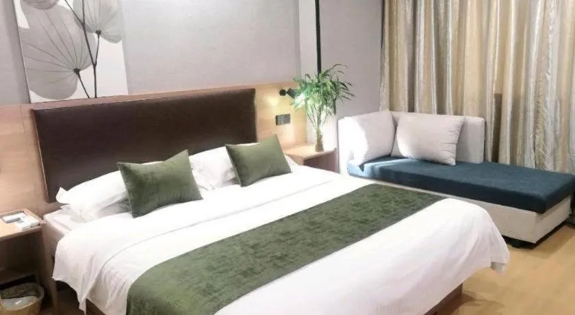 Bed in GreenTree Inn Yixing Zhangzhu Express Hotel