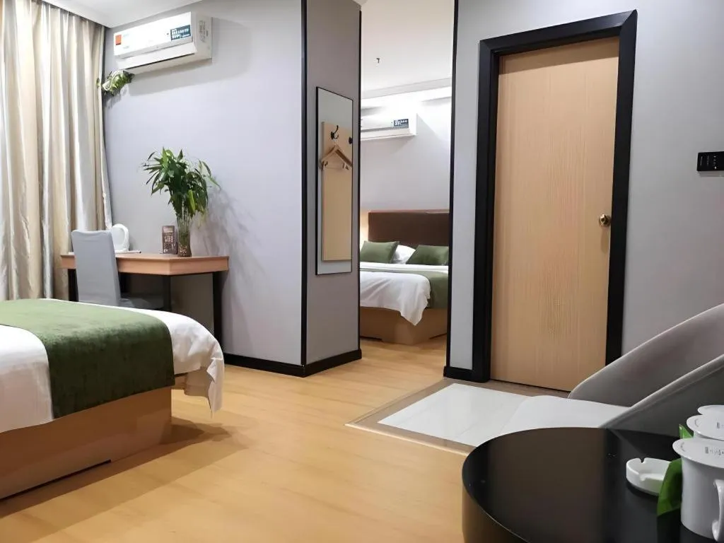 Bed in GreenTree Inn Yixing Zhangzhu Express Hotel