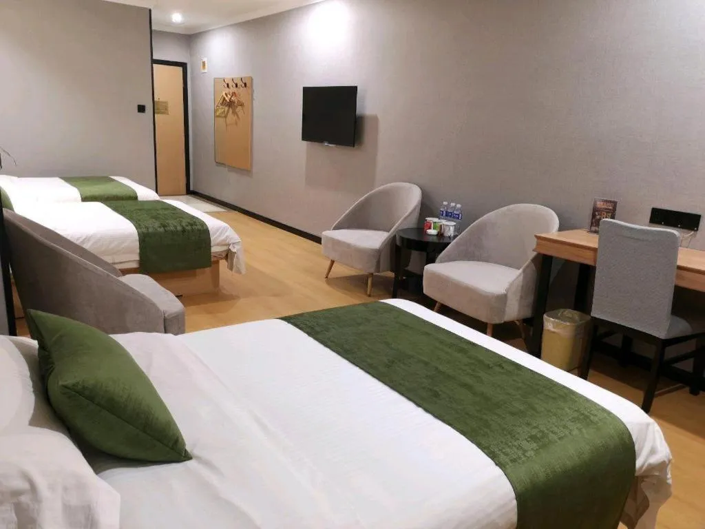 Bed in GreenTree Inn Yixing Zhangzhu Express Hotel