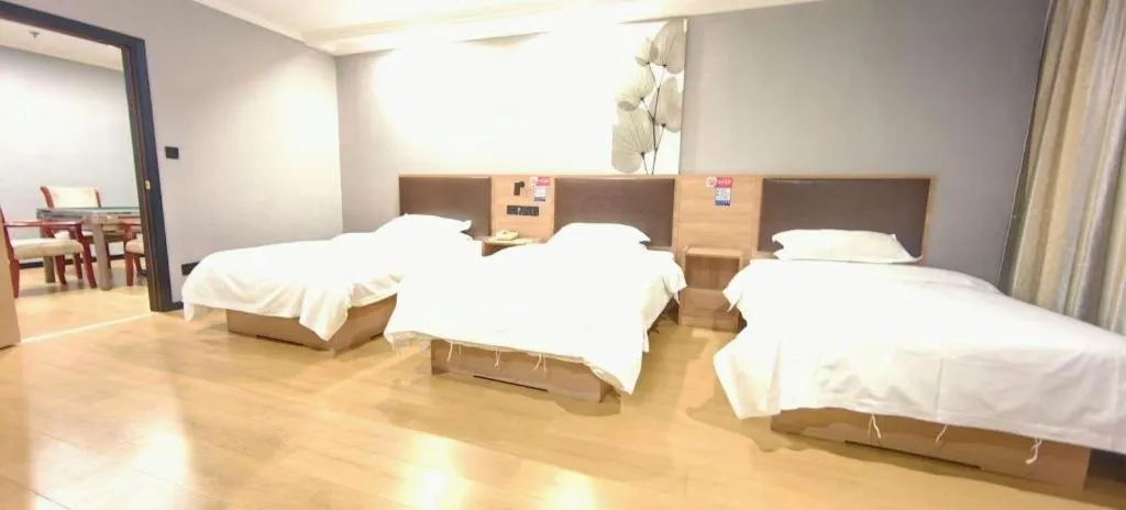 Bed in GreenTree Inn Yixing Zhangzhu Express Hotel