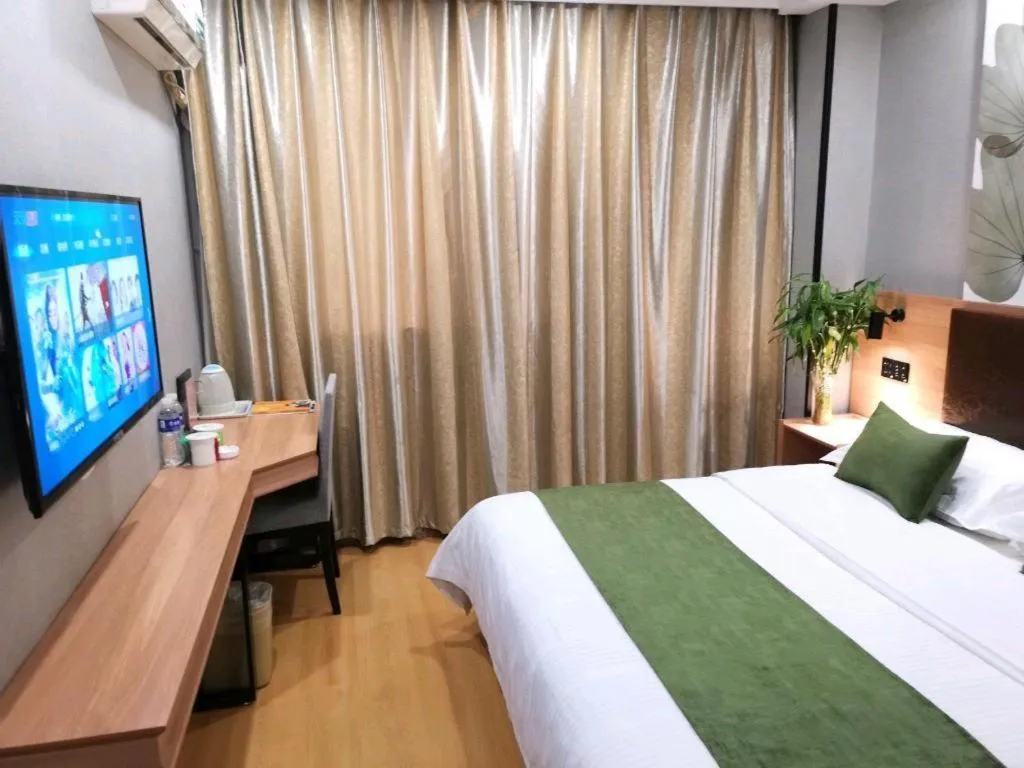 Bed in GreenTree Inn Yixing Zhangzhu Express Hotel