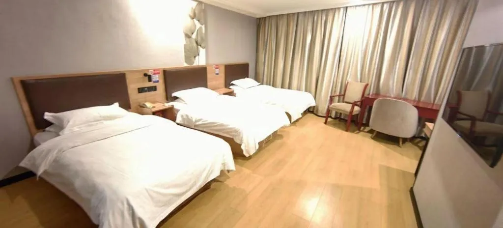 Bed in GreenTree Inn Yixing Zhangzhu Express Hotel