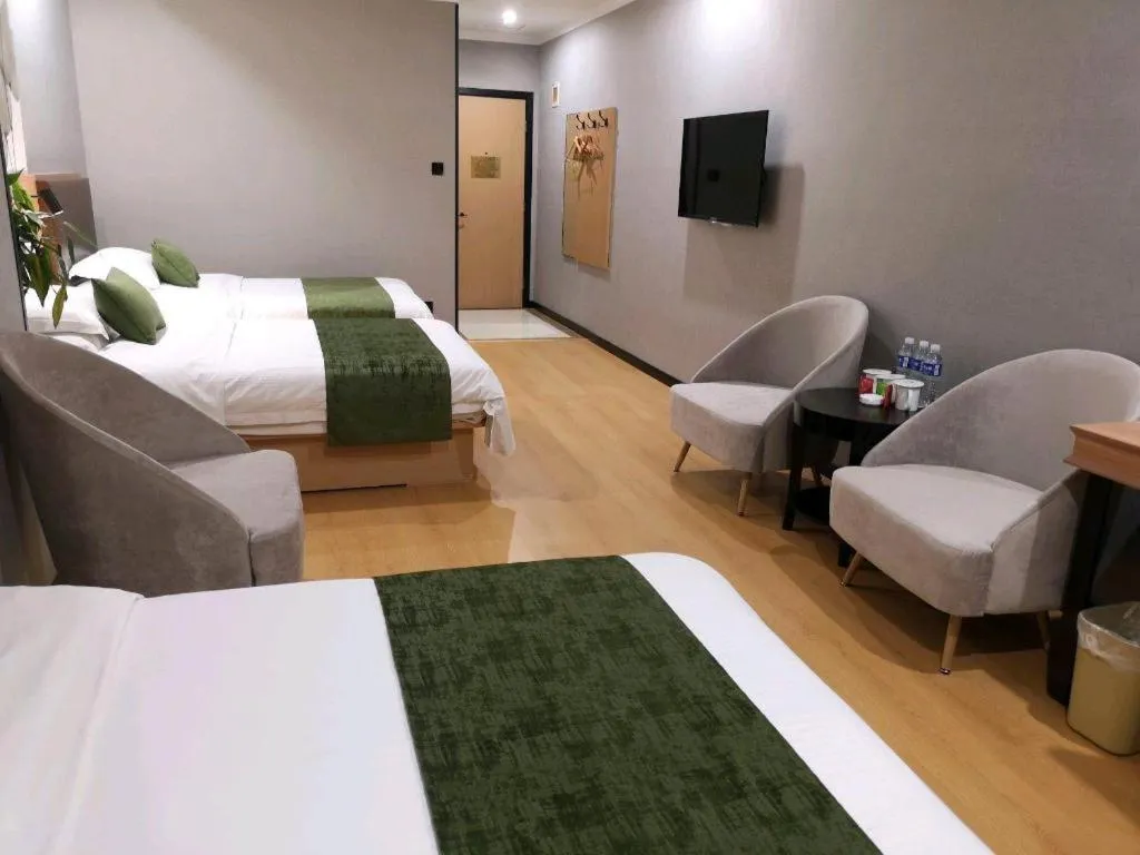 Bed in GreenTree Inn Yixing Zhangzhu Express Hotel