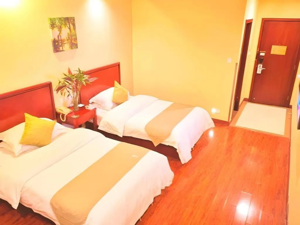 Bed in GreenTree Inn Yixing Zhangzhu Express Hotel