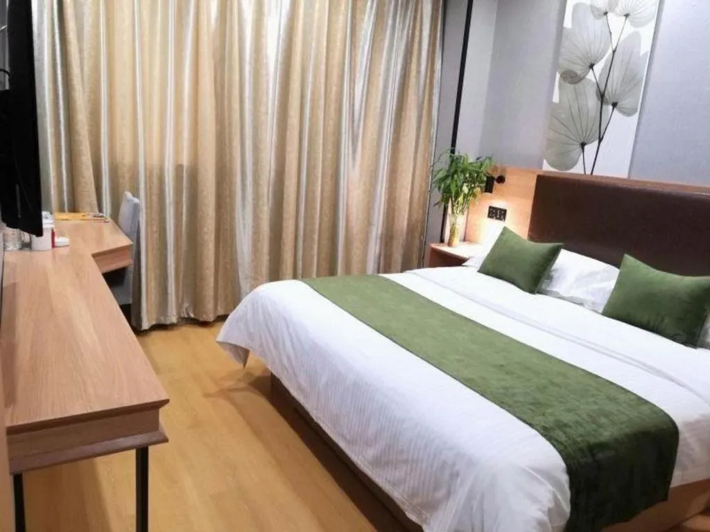 Bed in GreenTree Inn Yixing Zhangzhu Express Hotel