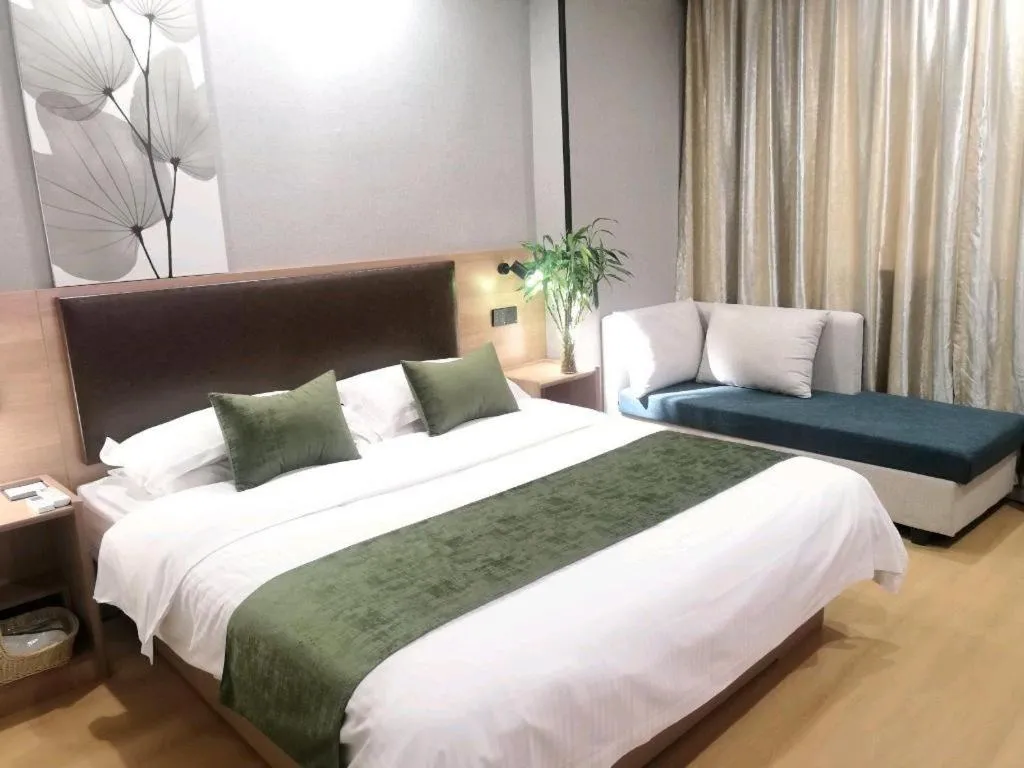 Bed in GreenTree Inn Yixing Zhangzhu Express Hotel
