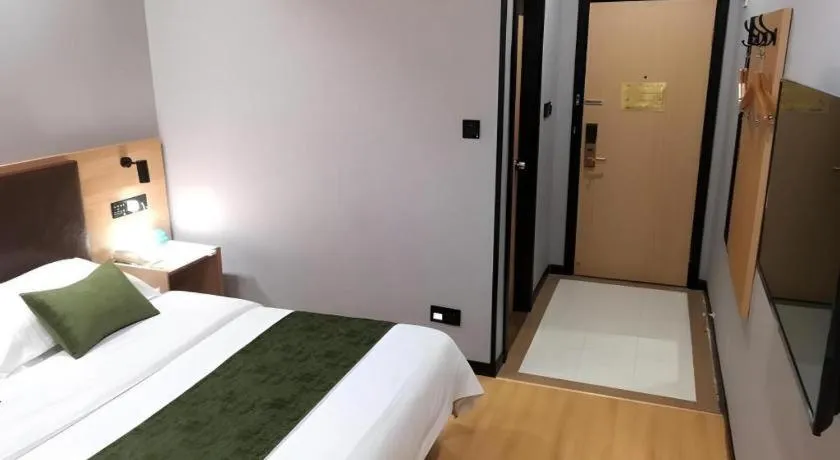 Bed in GreenTree Inn Yixing Zhangzhu Express Hotel