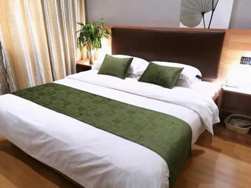 Bed in GreenTree Inn Yixing Zhangzhu Express Hotel