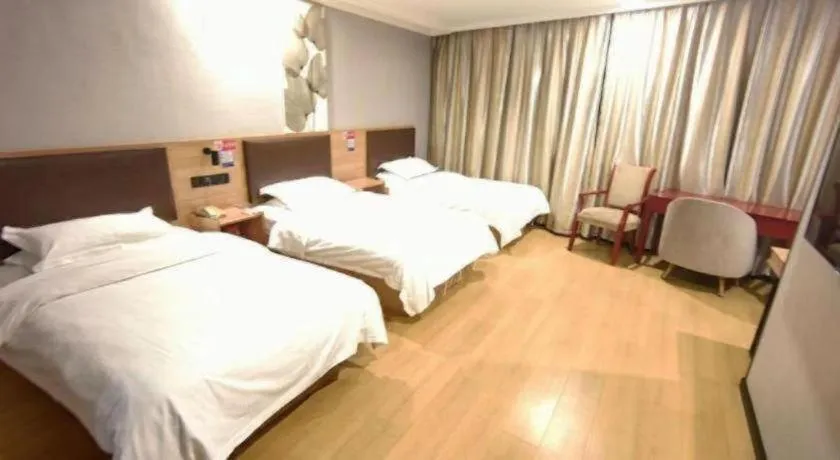 Bed in GreenTree Inn Yixing Zhangzhu Express Hotel