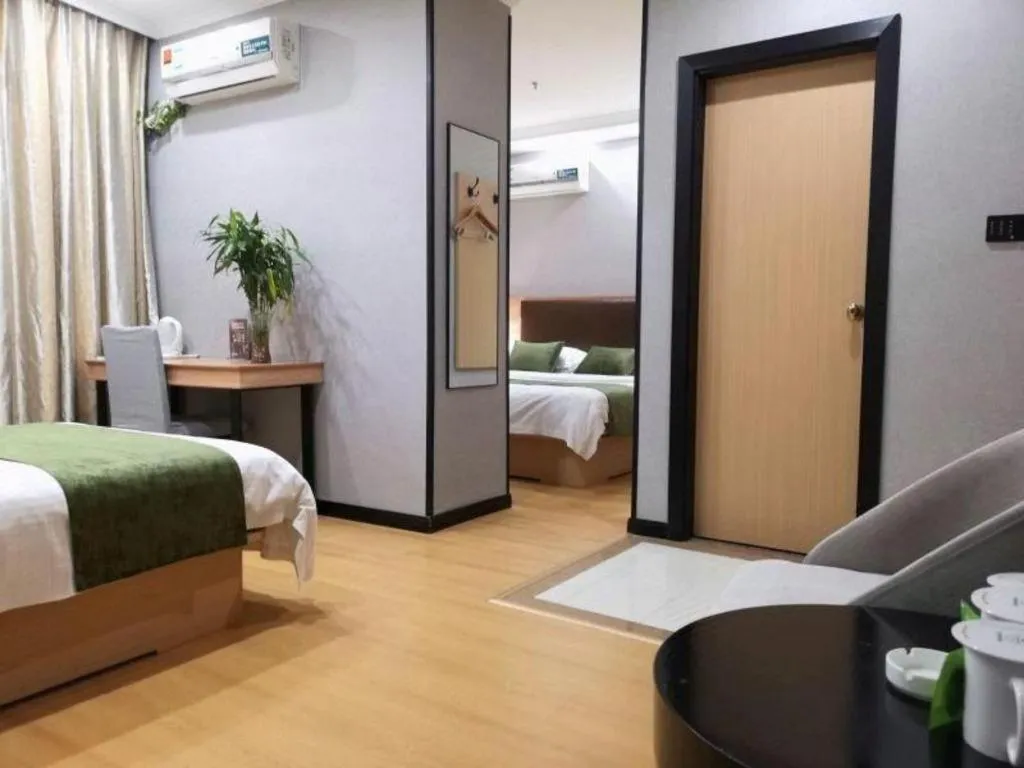 Bed in GreenTree Inn Yixing Zhangzhu Express Hotel