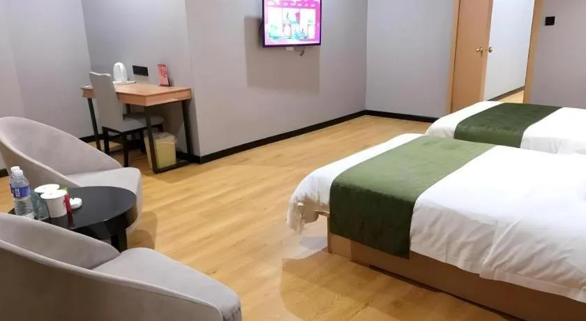 Bed in GreenTree Inn Yixing Zhangzhu Express Hotel