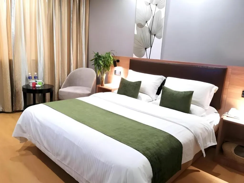 Bed in GreenTree Inn Yixing Zhangzhu Express Hotel
