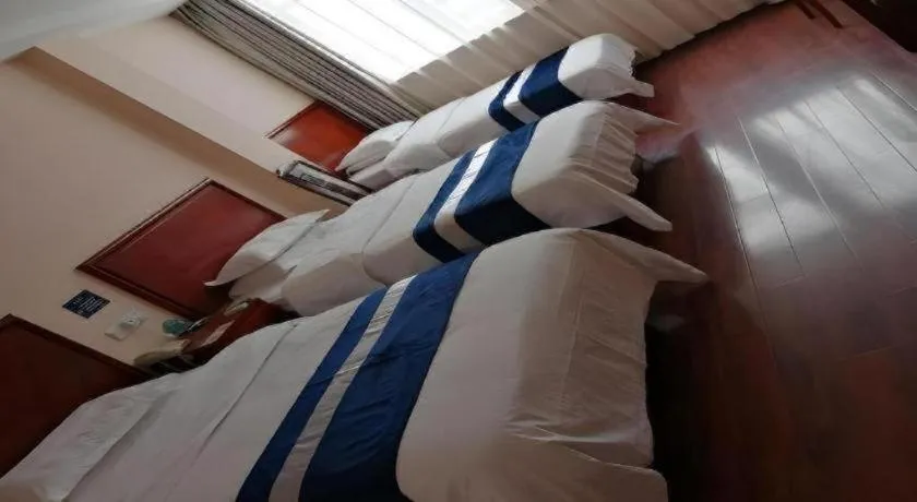 Bed in GreenTree Inn Nantong Haian Kaifa District Express Hotel